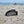 Load image into Gallery viewer, the steeltooth comb on a beach in florida in the sand. 

