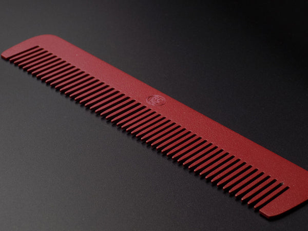 Steeltooth Rebel limited edition comb powder coated in a blood red color with a steel stamp. 