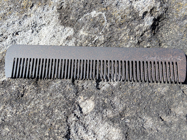 A steeltooth new standard comb with a deep red/brown finish, wide view.   