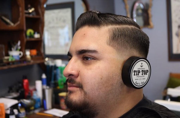 mexican man using tip top pomade